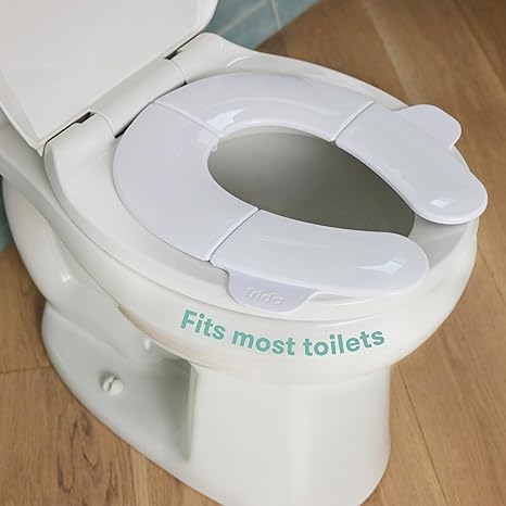 Frida Baby Fold-and-Go Potty Seat for Toilet | Foldable Travel Potty Seat for Toddler, Fits Round & Oval Toilets, Non-Slip Base, Handles, Includes Free Travel Bag C29